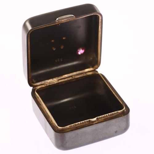 1105 - ROYAL INTEREST - an early 20th century gun-metal silver and pink tourmaline square pillbox, by Ugo F... 