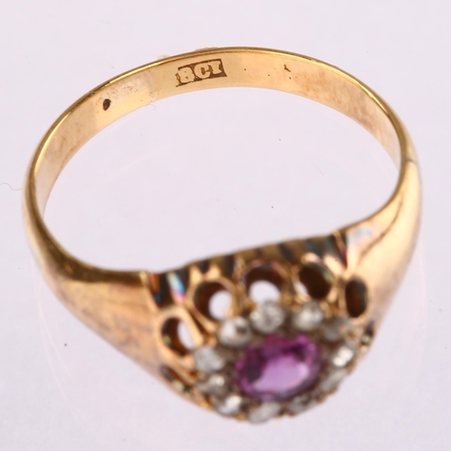 1113 - An early 20th century 18ct gold glass-filled ruby and diamond circular cluster ring, set with round-... 