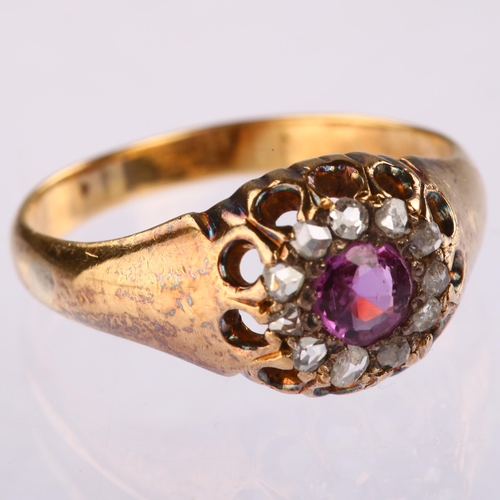 1113 - An early 20th century 18ct gold glass-filled ruby and diamond circular cluster ring, set with round-... 