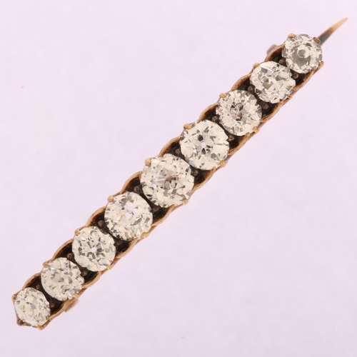 1116 - A Victorian graduated nine stone diamond line bar brooch, unmarked gold set with old European-cut di... 