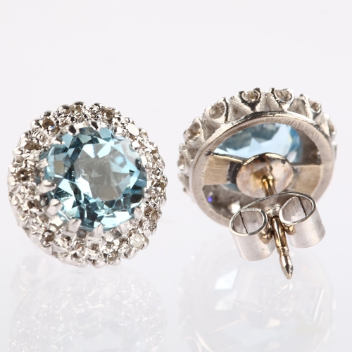 1126 - A pair of aquamarine and diamond round cluster earrings, unmarked white metal settings with round-cu... 