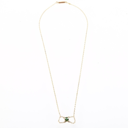 1127 - An Edwardian 9ct rose gold green tourmaline lavaliere necklace, bezel set with round-cut tourmaline ... 