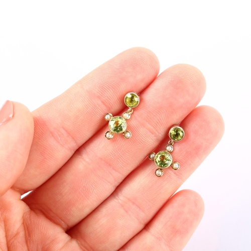 1128 - A pair of Edwardian 9ct gold peridot and pearl drop earrings, in quatrefoil form with stud fittings,... 