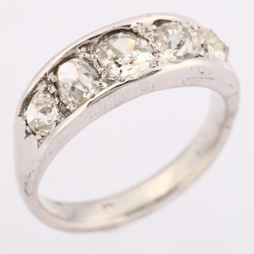 1132 - A graduated five stone diamond half hoop ring, unmarked white metal settings with old-cut diamonds, ... 