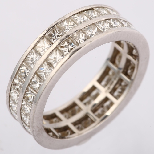 1133 - A platinum double-row full eternity ring, set with Princess-cut diamonds, total diamond content appr... 