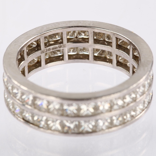 1133 - A platinum double-row full eternity ring, set with Princess-cut diamonds, total diamond content appr... 