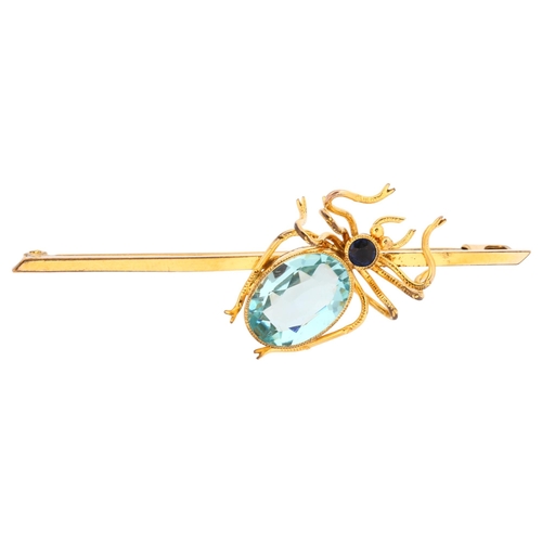 1137 - An Edwardian sapphire and blue topaz figural spider bar brooch, circa 1910, unmarked yellow metal se... 