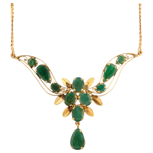 1141 - A Middle Eastern emerald floral collar necklace, unmarked high carat gold settings with oval and pea... 