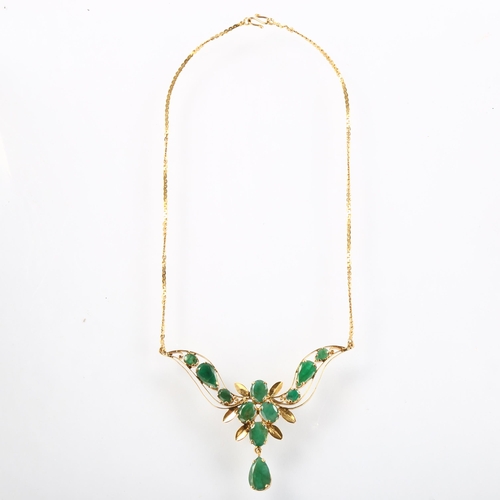 1141 - A Middle Eastern emerald floral collar necklace, unmarked high carat gold settings with oval and pea... 