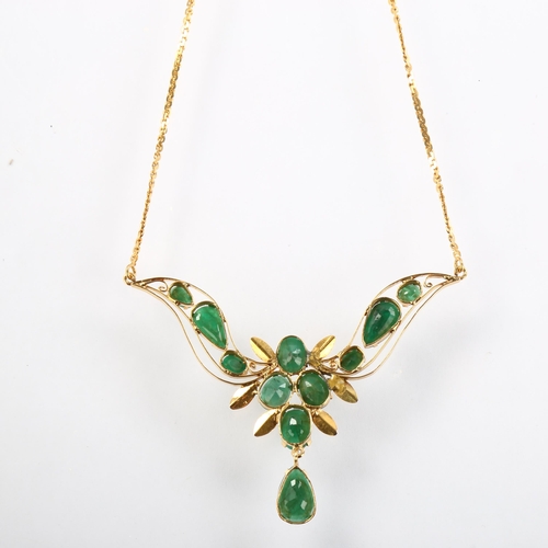 1141 - A Middle Eastern emerald floral collar necklace, unmarked high carat gold settings with oval and pea... 