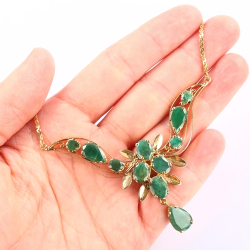 1141 - A Middle Eastern emerald floral collar necklace, unmarked high carat gold settings with oval and pea... 