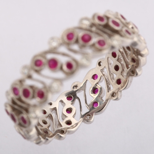 1142 - LUKE STOCKLEY - an 18ct white gold ruby and diamond full eternity ring, in Art Deco style, pierced o... 