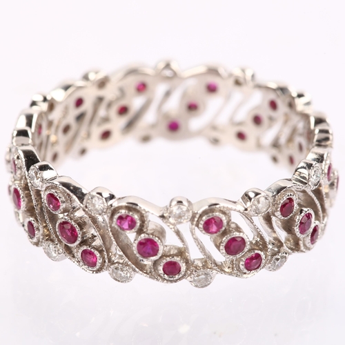 1142 - LUKE STOCKLEY - an 18ct white gold ruby and diamond full eternity ring, in Art Deco style, pierced o... 