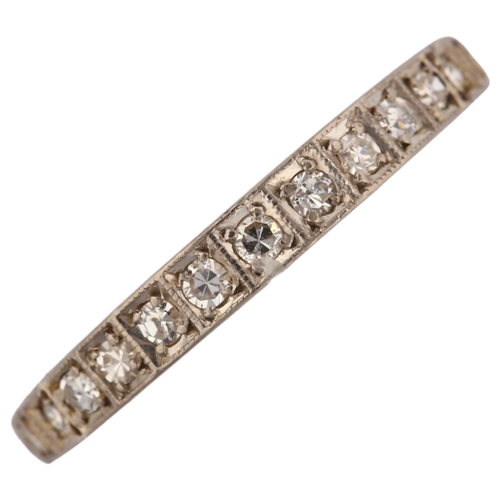 1147 - An 18ct gold diamond three quarter eternity ring, set with single-cut diamonds and foliate scrollwor... 