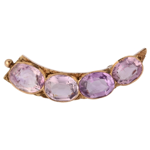 1153 - An Antique amethyst cornucopia brooch, unmarked gold settings with oval mixed-cut amethysts, 44.6mm,... 