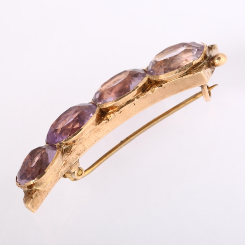 1153 - An Antique amethyst cornucopia brooch, unmarked gold settings with oval mixed-cut amethysts, 44.6mm,... 