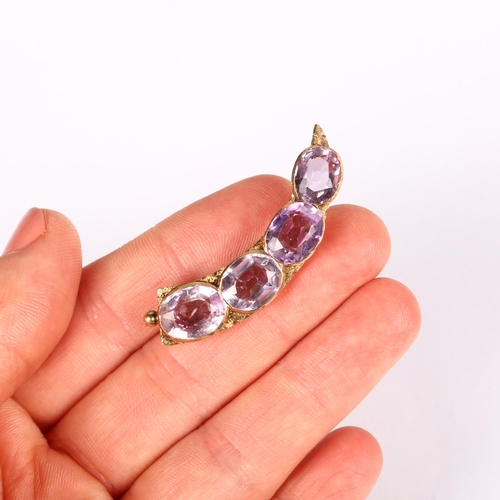 1153 - An Antique amethyst cornucopia brooch, unmarked gold settings with oval mixed-cut amethysts, 44.6mm,... 