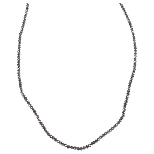 1156 - A modern 18ct white gold black diamond bead necklace, set with rough-cut black diamond beads, bead d... 