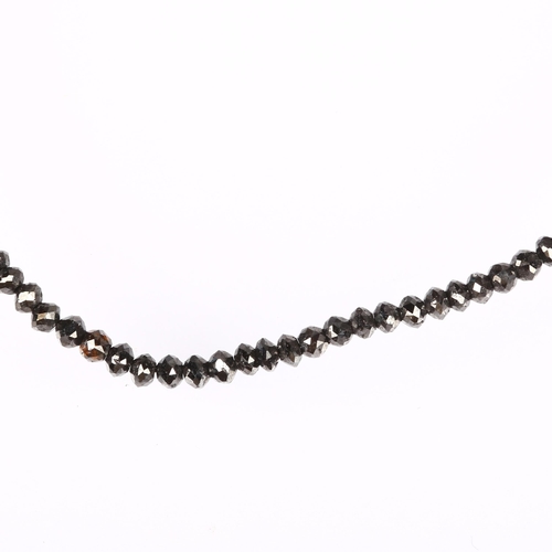 1156 - A modern 18ct white gold black diamond bead necklace, set with rough-cut black diamond beads, bead d... 