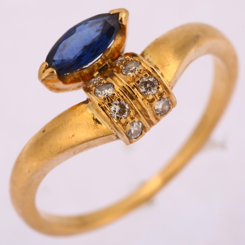 1260 - An 18ct gold sapphire and diamond dress ring, set with marquise-cut sapphire and modern round brilli... 