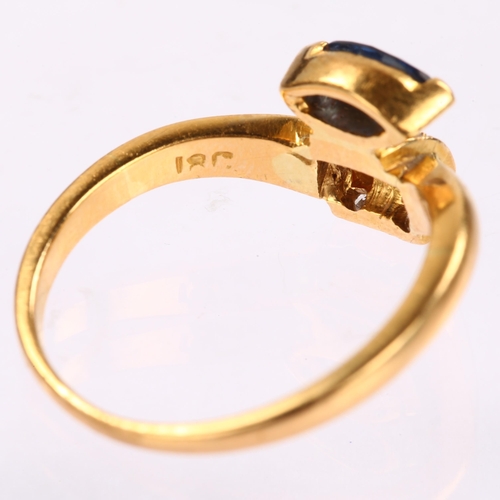 1260 - An 18ct gold sapphire and diamond dress ring, set with marquise-cut sapphire and modern round brilli... 