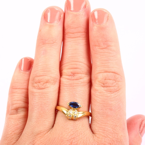 1260 - An 18ct gold sapphire and diamond dress ring, set with marquise-cut sapphire and modern round brilli... 