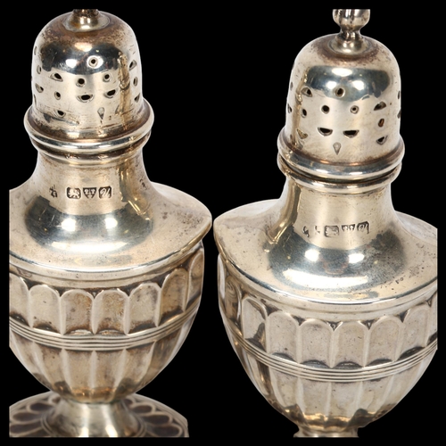 1525 - A pair of George V silver Adams style urn pepperettes, indistinct maker, Chester 1920, 10cm, 2.3oz