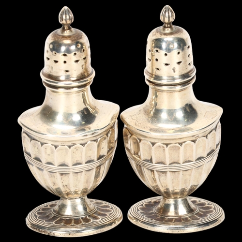 1525 - A pair of George V silver Adams style urn pepperettes, indistinct maker, Chester 1920, 10cm, 2.3oz