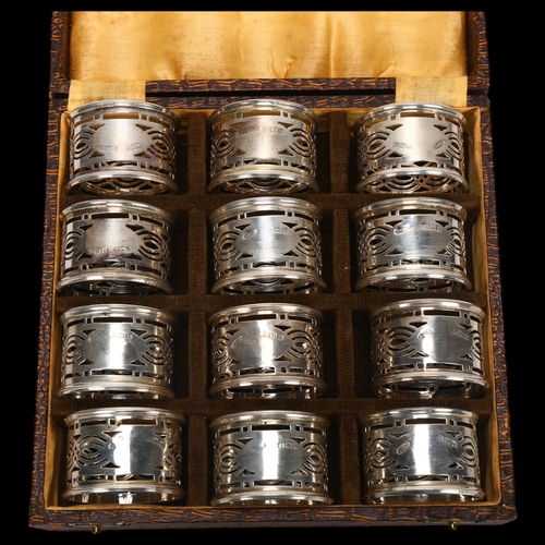 1551 - A cased set of George V silver napkin rings, Britton, Gould & Co, Birmingham 1928, cylindrical form ... 