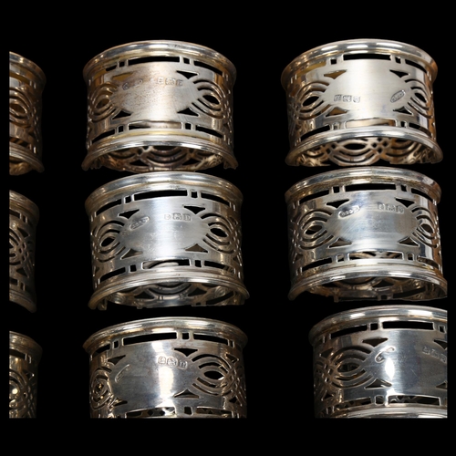 1551 - A cased set of George V silver napkin rings, Britton, Gould & Co, Birmingham 1928, cylindrical form ... 