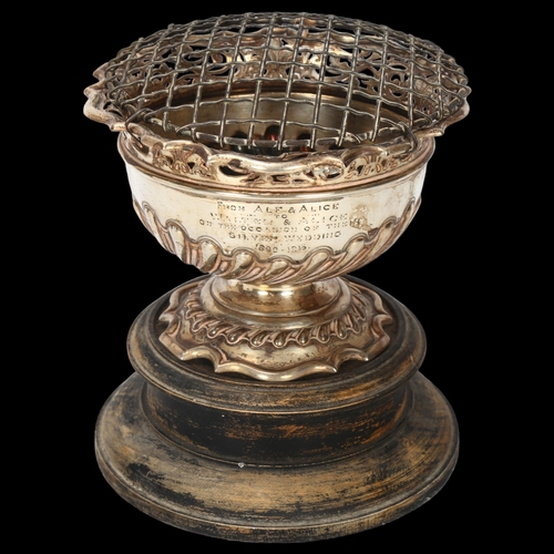 1553 - An Edwardian silver pedestal trophy rose bowl, Walker & Hall, Sheffield 1903, circular form with sca... 