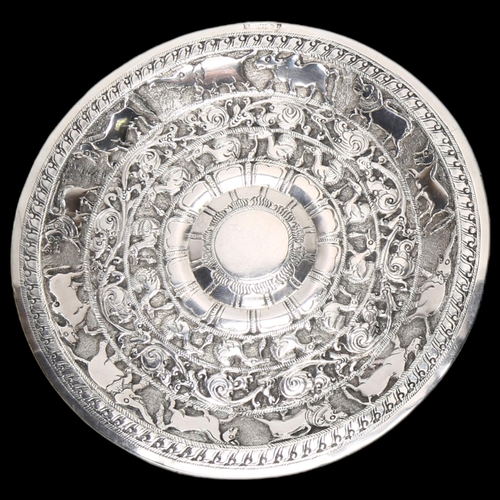 1569 - An Indian silver dish, relief embossed animal decoration, indistinct marks on rim, diameter 14cm, 2.... 