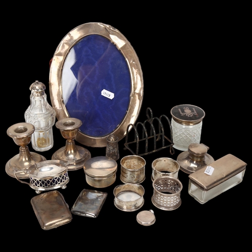 1579 - Various silver, including photo frame, pair of candlesticks, dressing table jar, toast rack etc