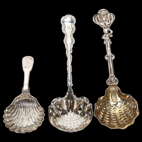 1580 - A William IV Scottish silver shell caddy spoon, and 2 decorative cast-silver sifter spoons, largest ... 