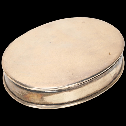 1581 - An Edwardian silver tobacco box, no maker, London 1906, plain oval form, 9cm, 2.7oz