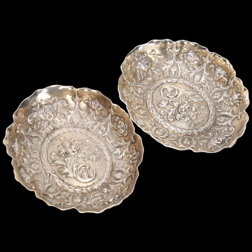 1585 - A pair of Victorian silver dishes, William Comyns, London 1889, oval lobed form with relief embossed... 