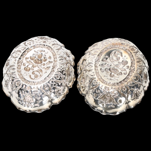 1585 - A pair of Victorian silver dishes, William Comyns, London 1889, oval lobed form with relief embossed... 