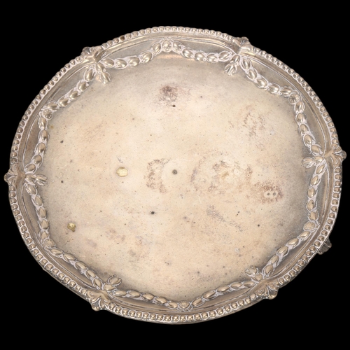 1586 - A George III circular silver salver, Robert Jones & John Scofield, London 1775, relief embossed Adam... 