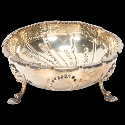 1587 - A Victorian silver bowl, indistinct maker, London 1874, circular form with relief embossed spiral be... 