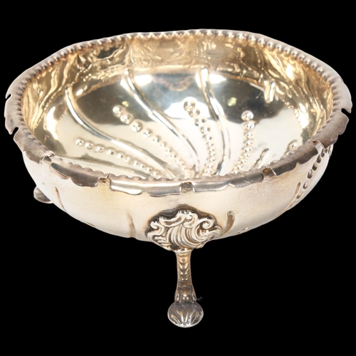 1587 - A Victorian silver bowl, indistinct maker, London 1874, circular form with relief embossed spiral be... 