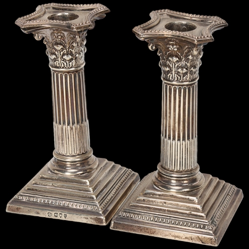 1592 - A pair of Victorian silver Corinthian column squat table candlesticks, William Hutton & Sons Ltd, Lo... 