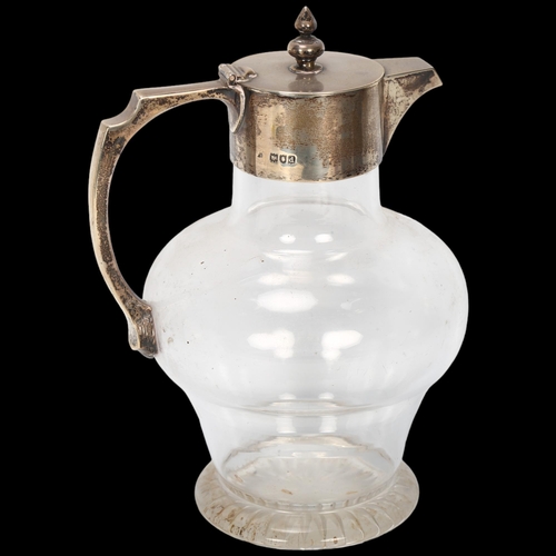 1594 - A late Victorian silver-mounted glass Claret jug, indistinct maker, London 1899, engraved presentati... 