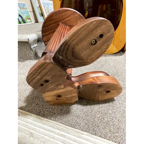 87 - A 1960s pine side table or stool in the form of a pair of boots, height 45cm