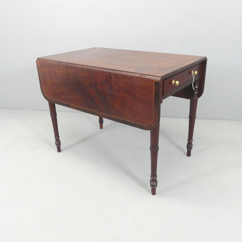 2661 - An antique mahogany Pembroke table, with end frieze drawer and raised on turned legs. 87x67x53cm (ex... 