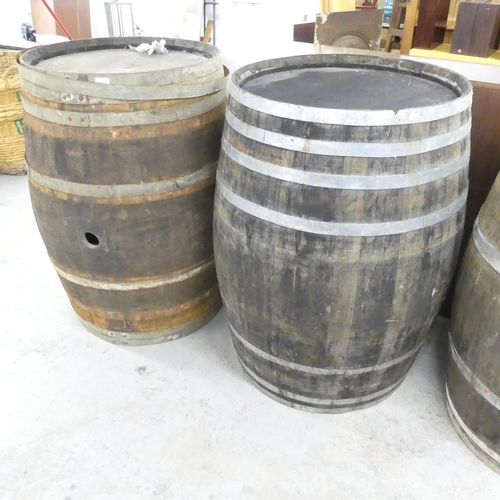 2676 - A matched pair of vintage coopered oak barrels. 75x100cm.