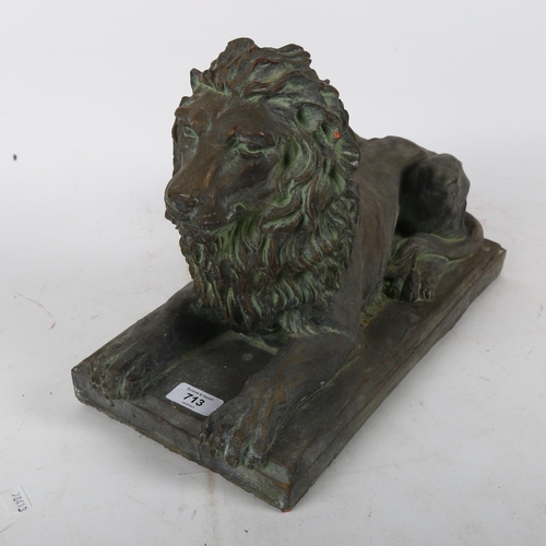 896 - A terracotta lion sculpture on plinth, with verdigris finish, L39cm overall