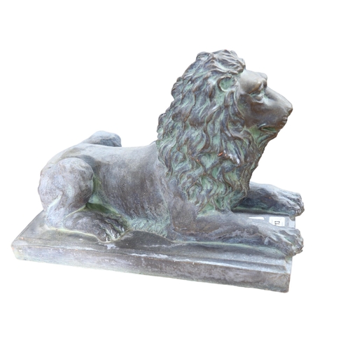 896 - A terracotta lion sculpture on plinth, with verdigris finish, L39cm overall