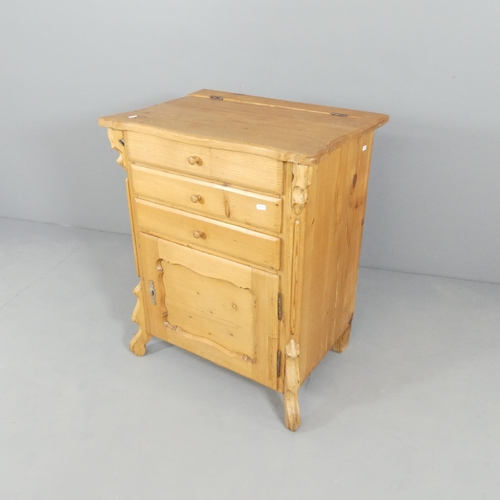 2704 - A continental pine washstand, with lifting top, single drawer and cupboard under. 66x80x48cm.