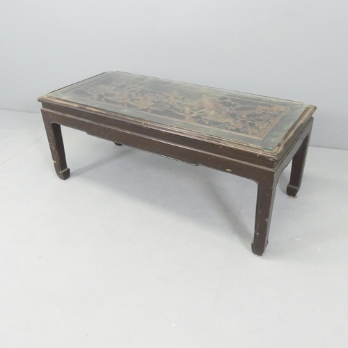 2714 - A Chinese opium table with glass top over carved decoration.   102x42x46cm.