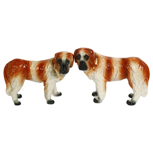 915 - A pair of 19th century Staffordshire St Bernard dog figurines, H24cm (2)